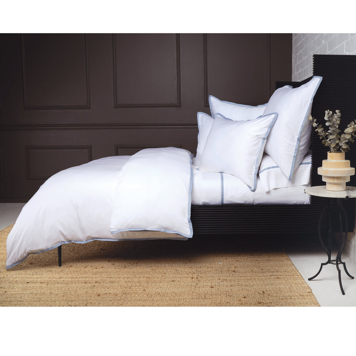 Bamboo sateen duvet cover set in white with dark piped trim and matching shams