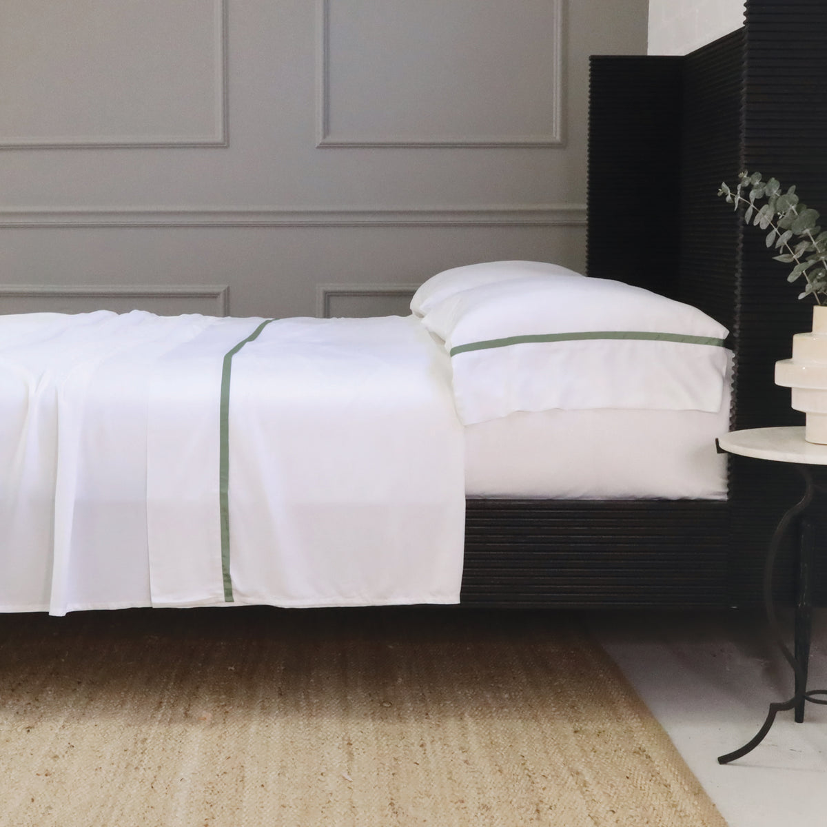 Langston bamboo sateen sheet set with white sheets and olive green stripe detail