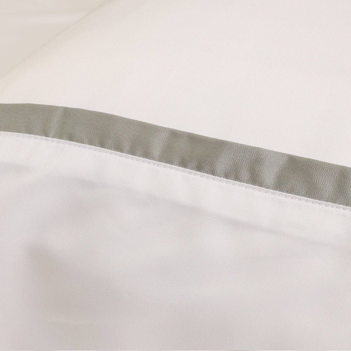 White duvet cover hem with a light gray underside band