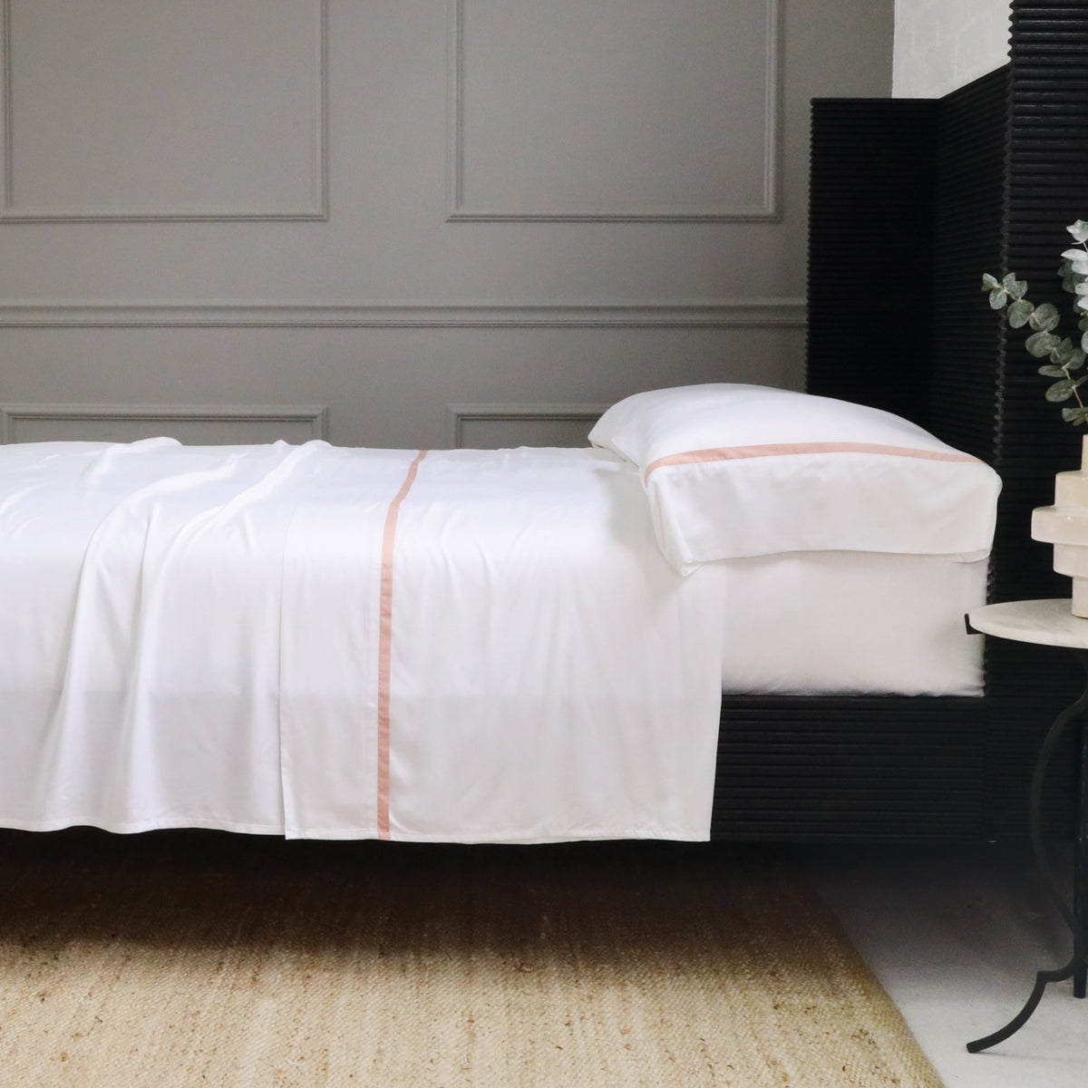 White bamboo sateen sheet set with coral stripe detail and matching pillowcase