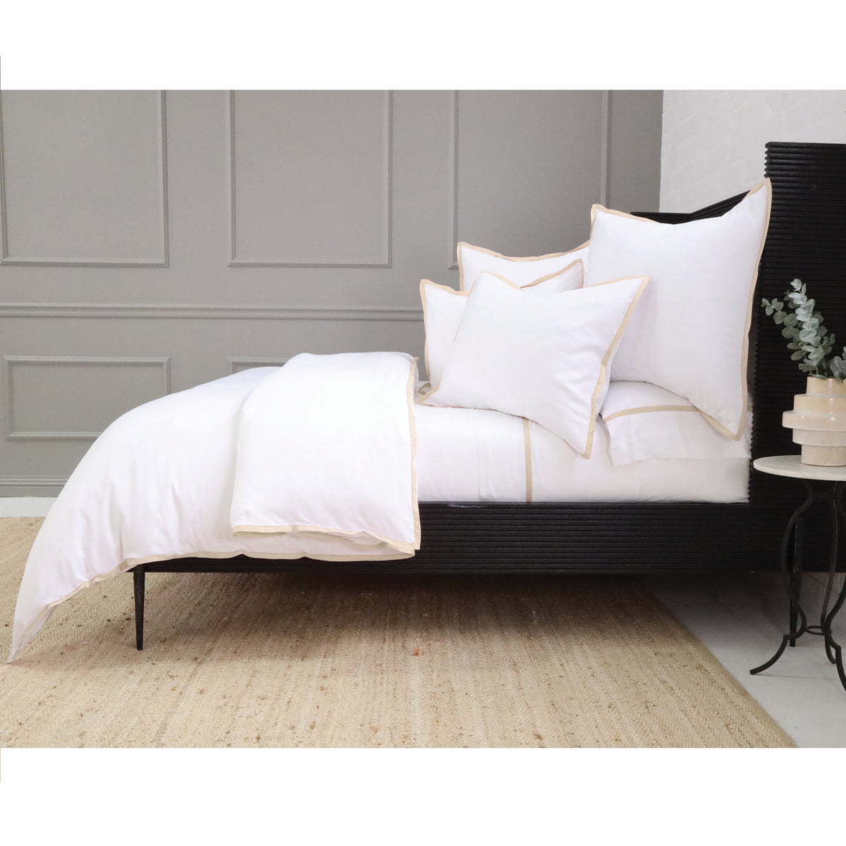 White duvet cover set with subtle light trim along the edges