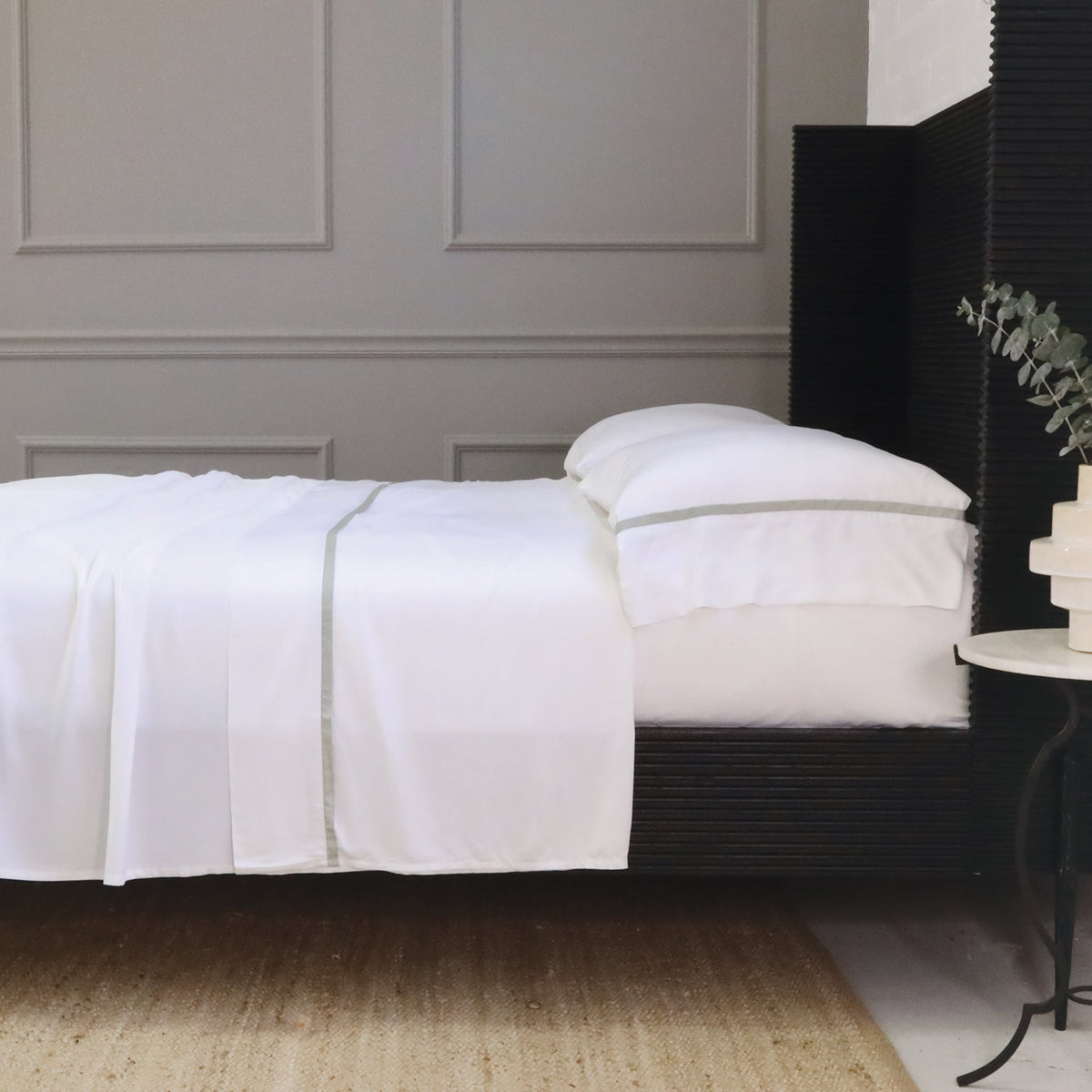 White bamboo sateen sheet set with tan stripe detail on fitted sheet edge