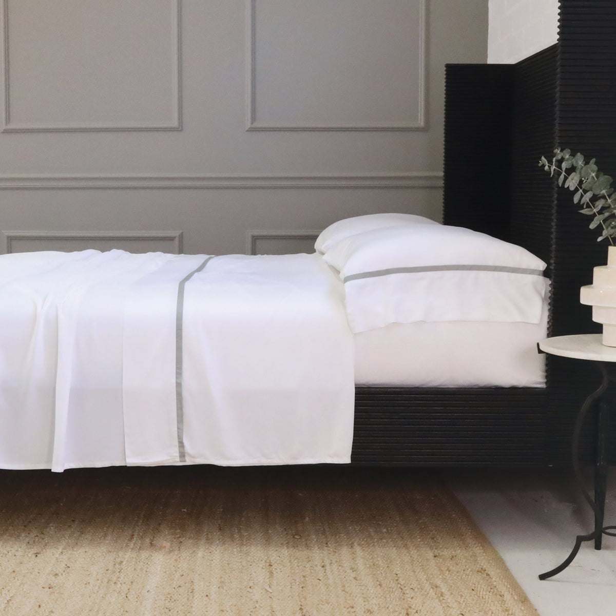 White bamboo sateen sheet set with light gray stripe detail and matching pillowcase