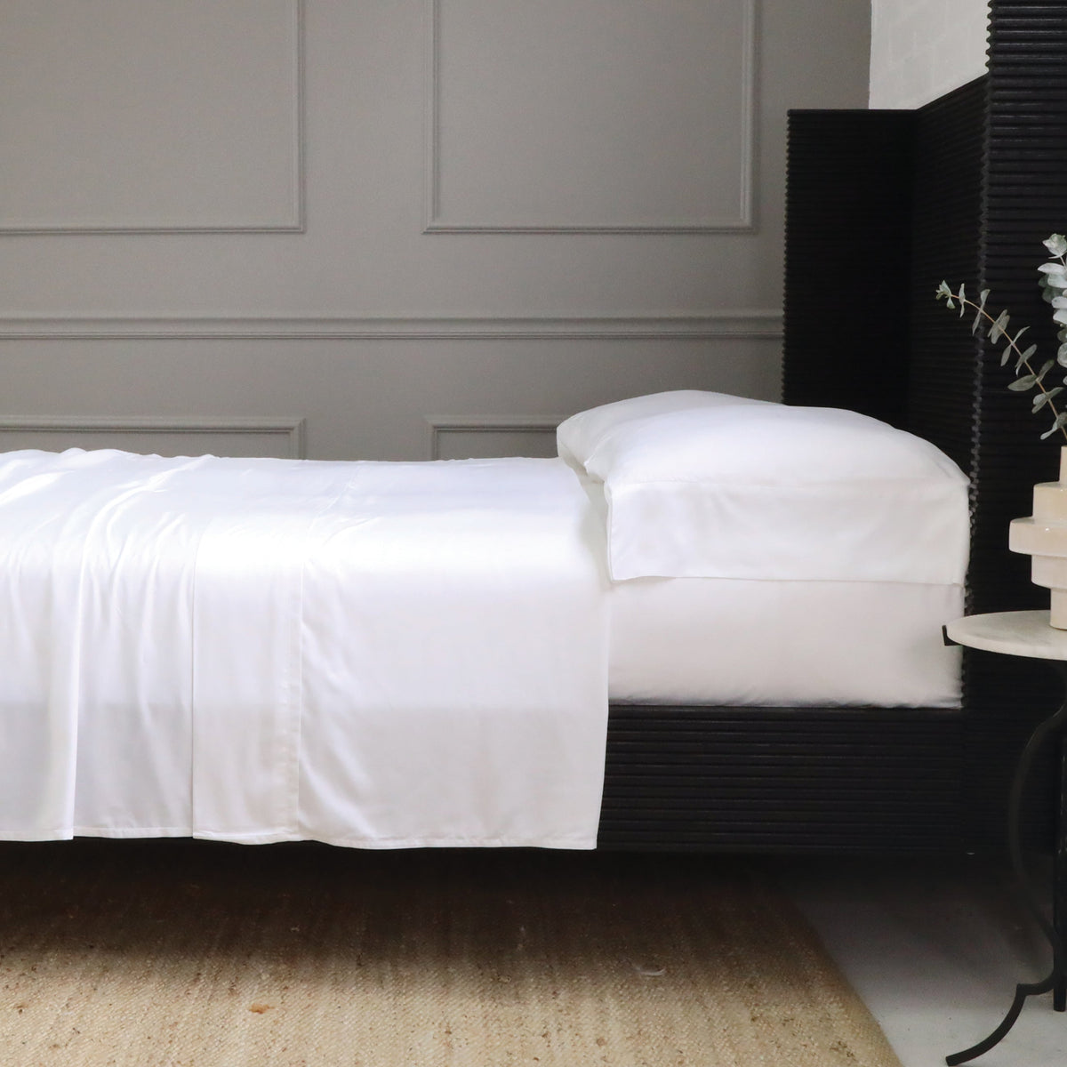 White bamboo sateen sheet set with matching pillowcase on bed