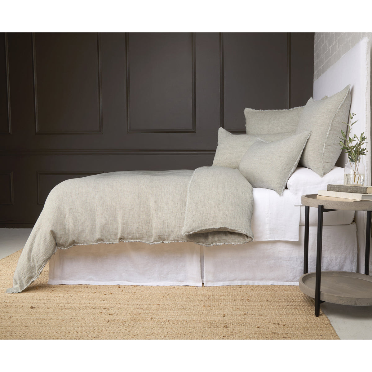 Light gray textured duvet cover set with fringed edge and matching pillow shams