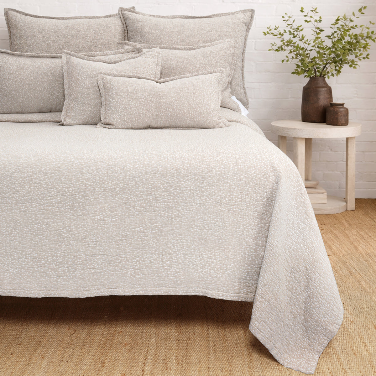 Oatmeal matelasse quilt with matching pillow shams and textured surface