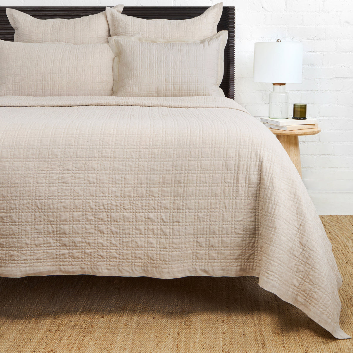 Owen quilted coverlet in flax with textured stitched pattern and matching shams