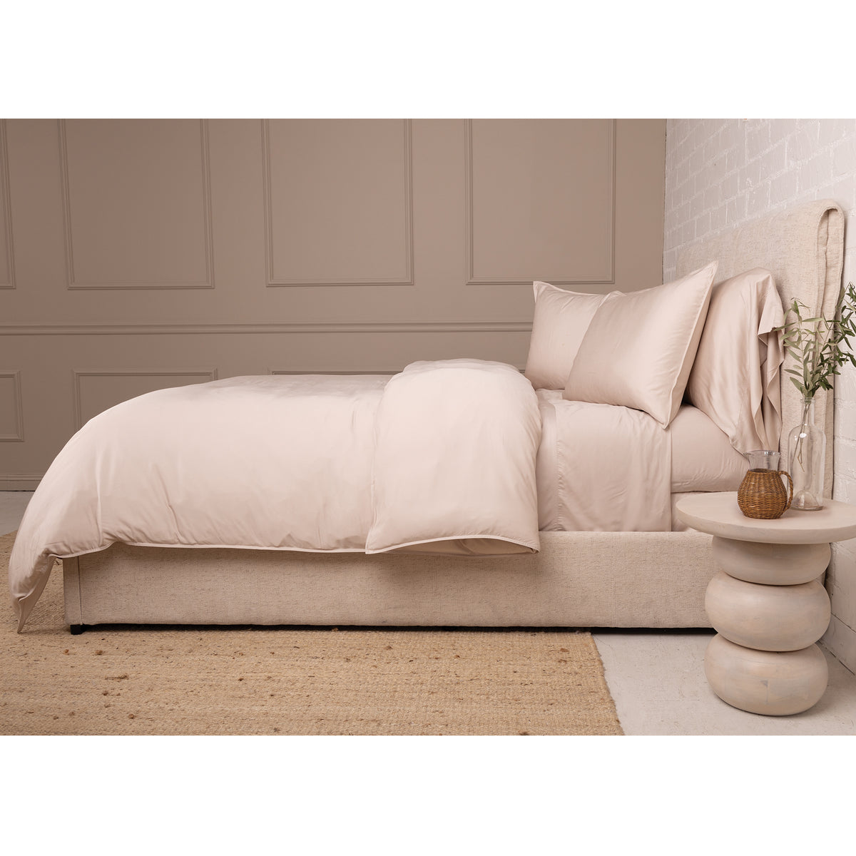 Ivory bamboo sateen duvet set with matching pillow shams on a bed