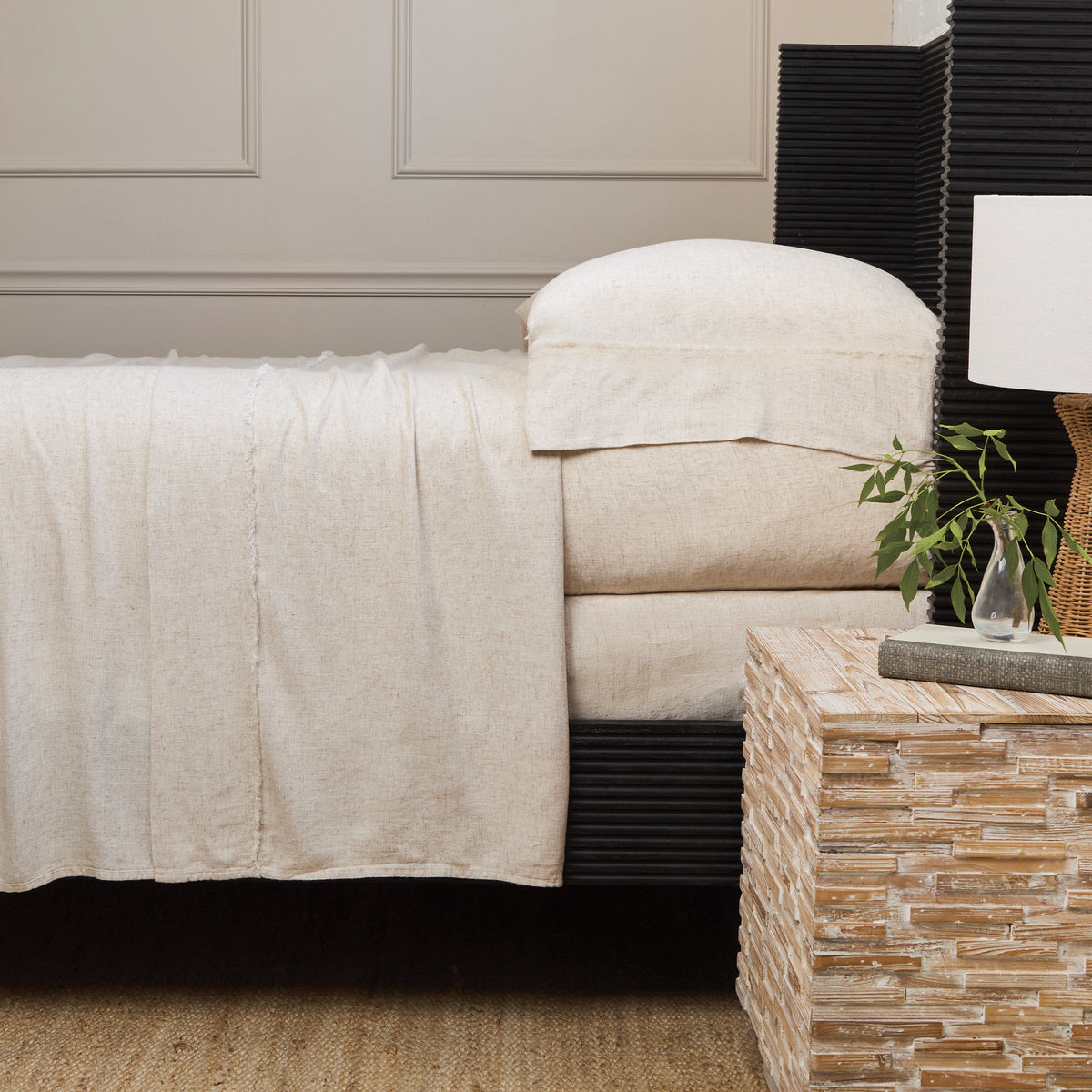 Natural bamboo linen sheet set with fitted sheet and matching pillowcases on a bed