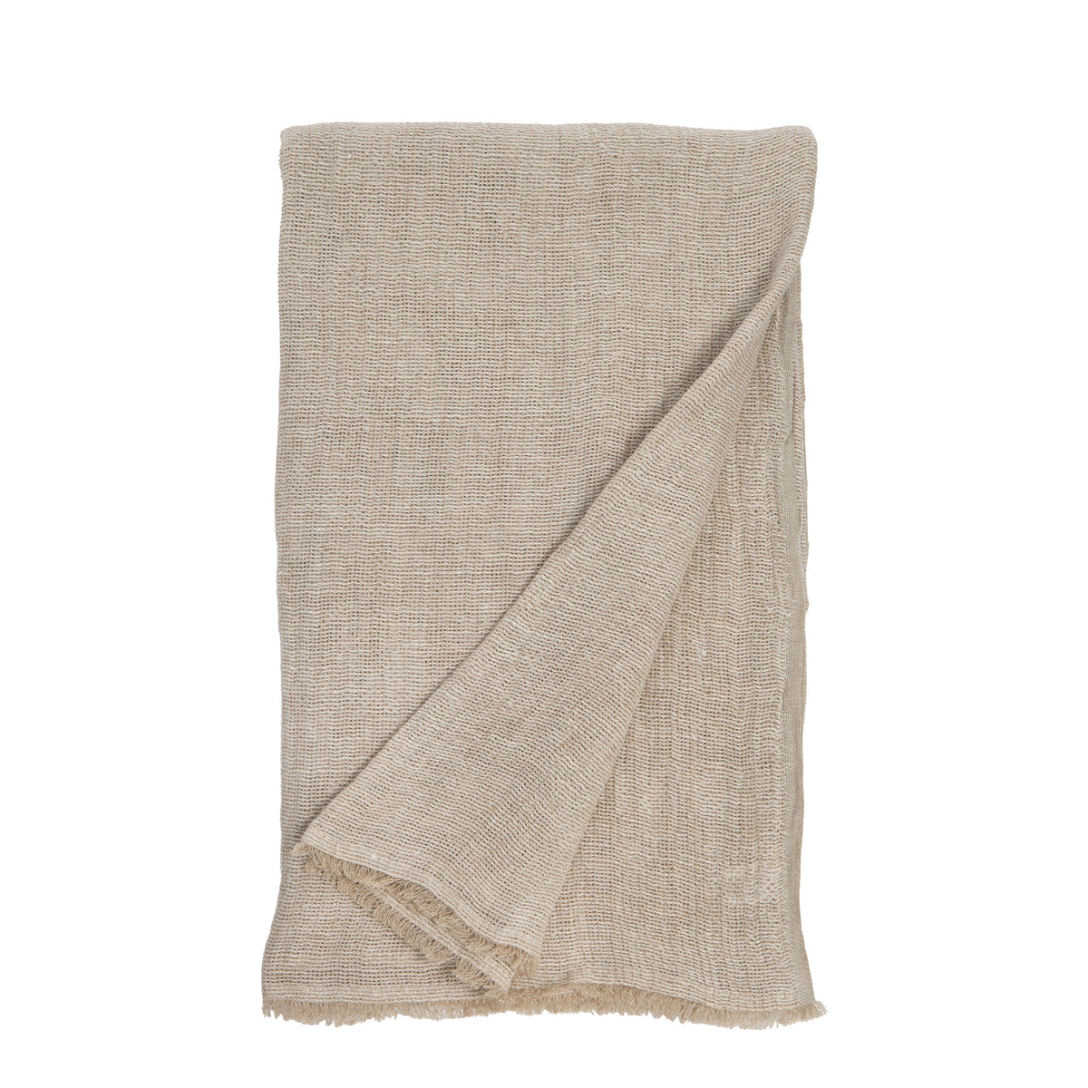 Natural beige oversized knit throw blanket with diagonal wrap and fringed edge on a white background.
