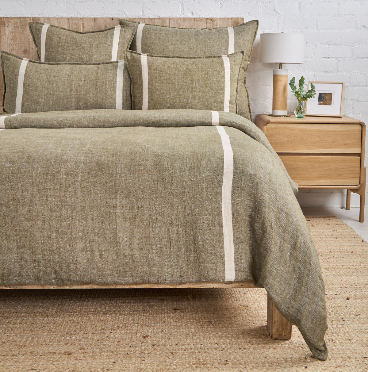 Olive-gray duvet cover with bold cream vertical stripe border and matching shams