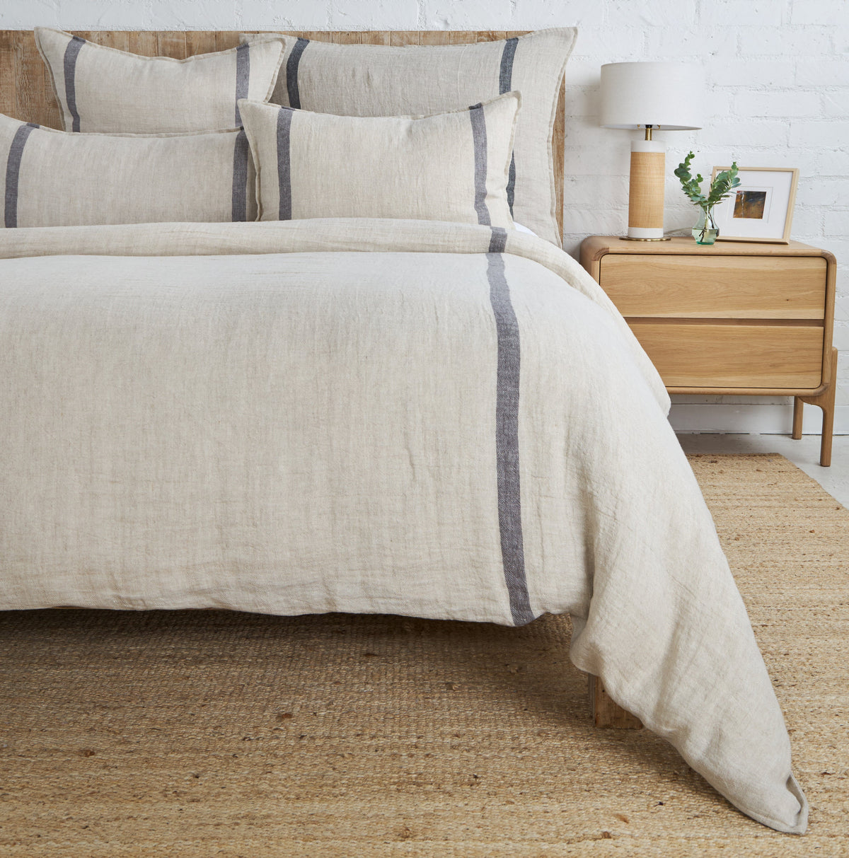 Linen-look duvet cover in light beige with vertical dark blue stripe detail