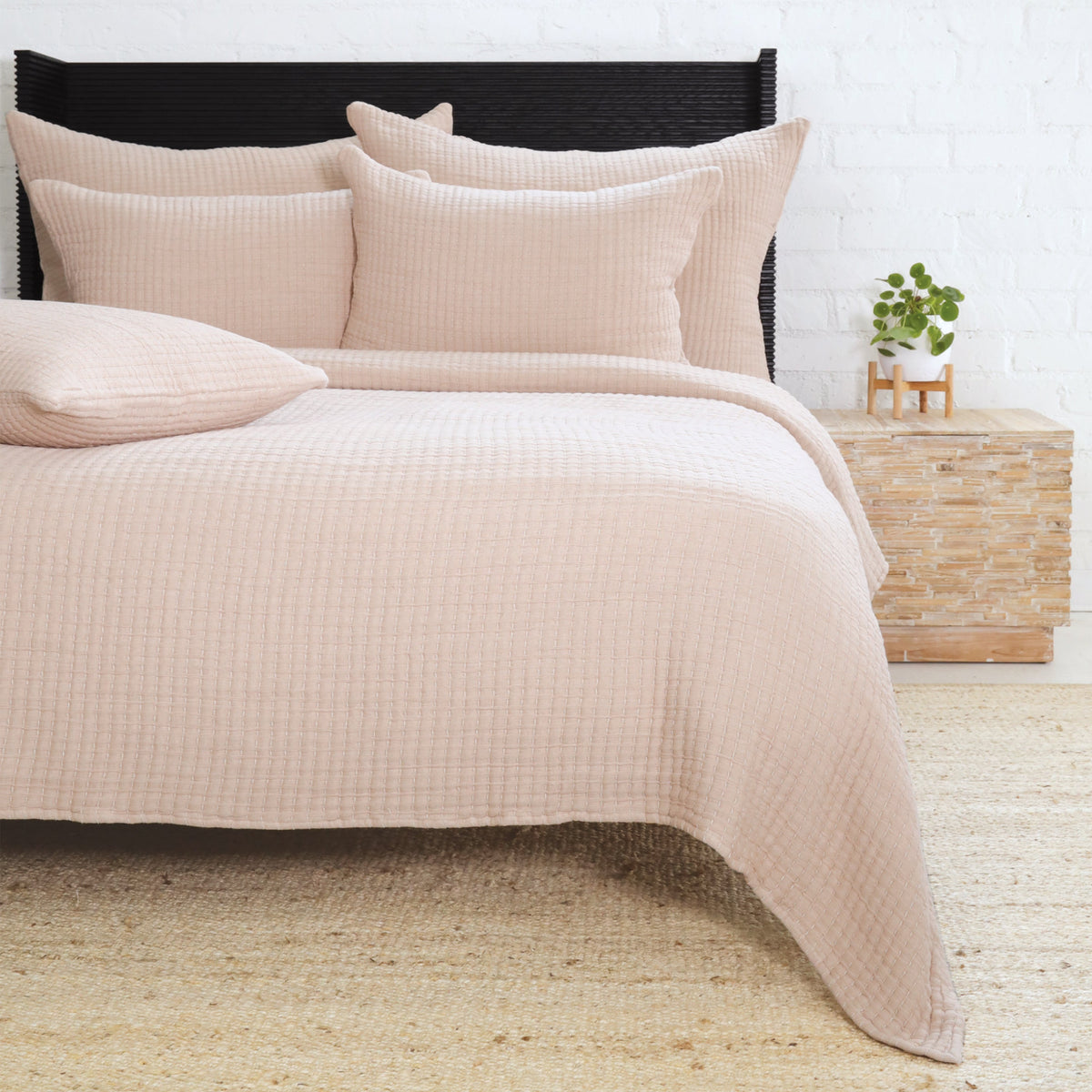 Beige textured coverlet set with coordinating shams