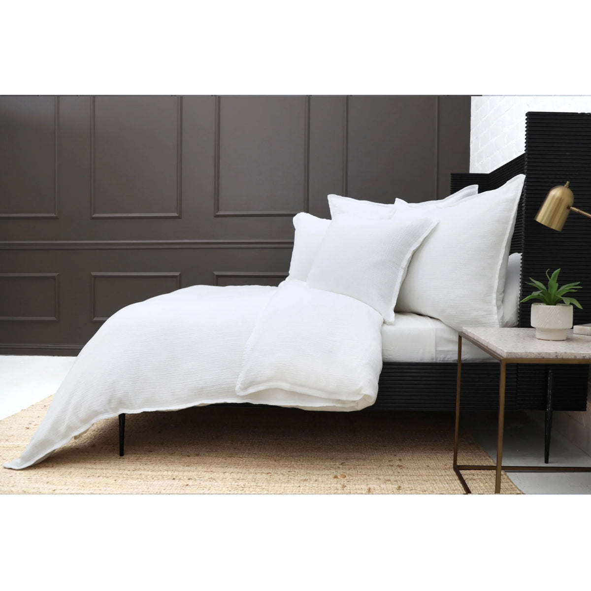 Rectangular throw pillow set with inserts, white bedding on bed