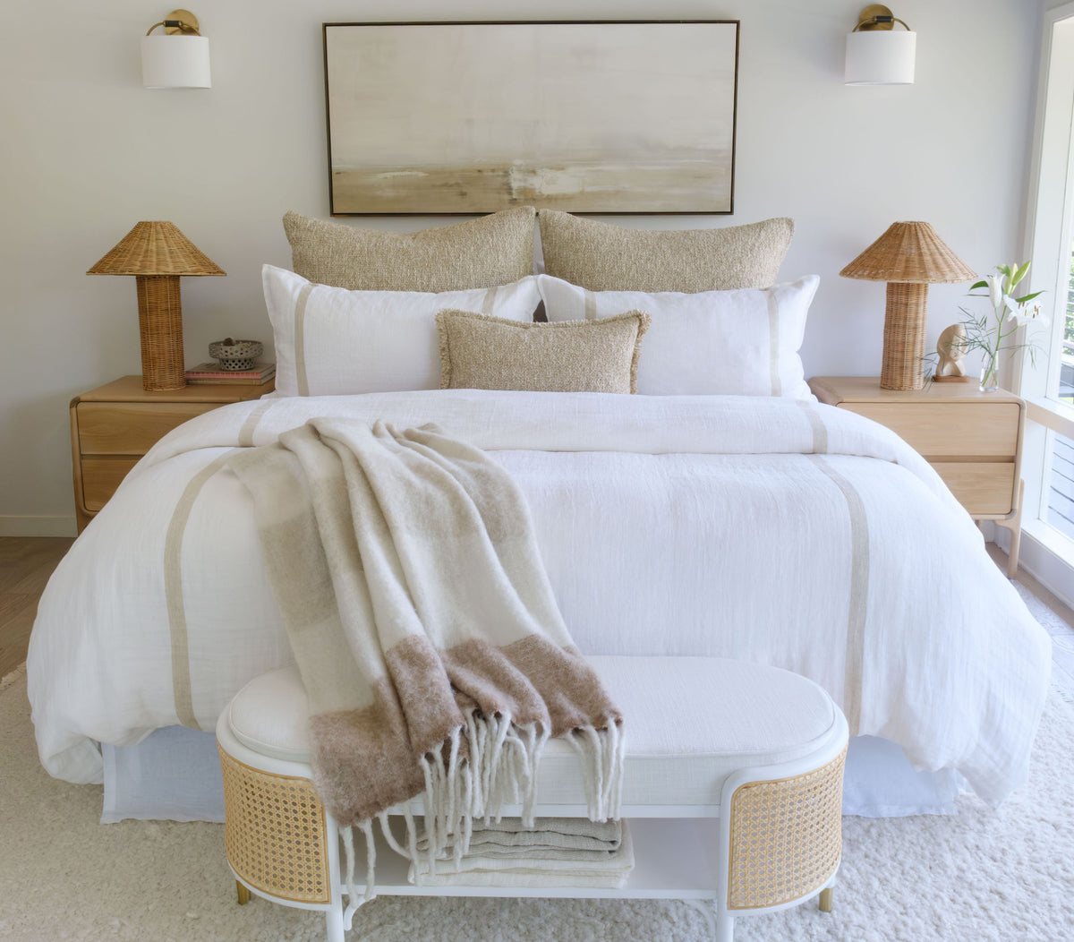 White linen-look duvet set with beige bordered accents and matching pillows