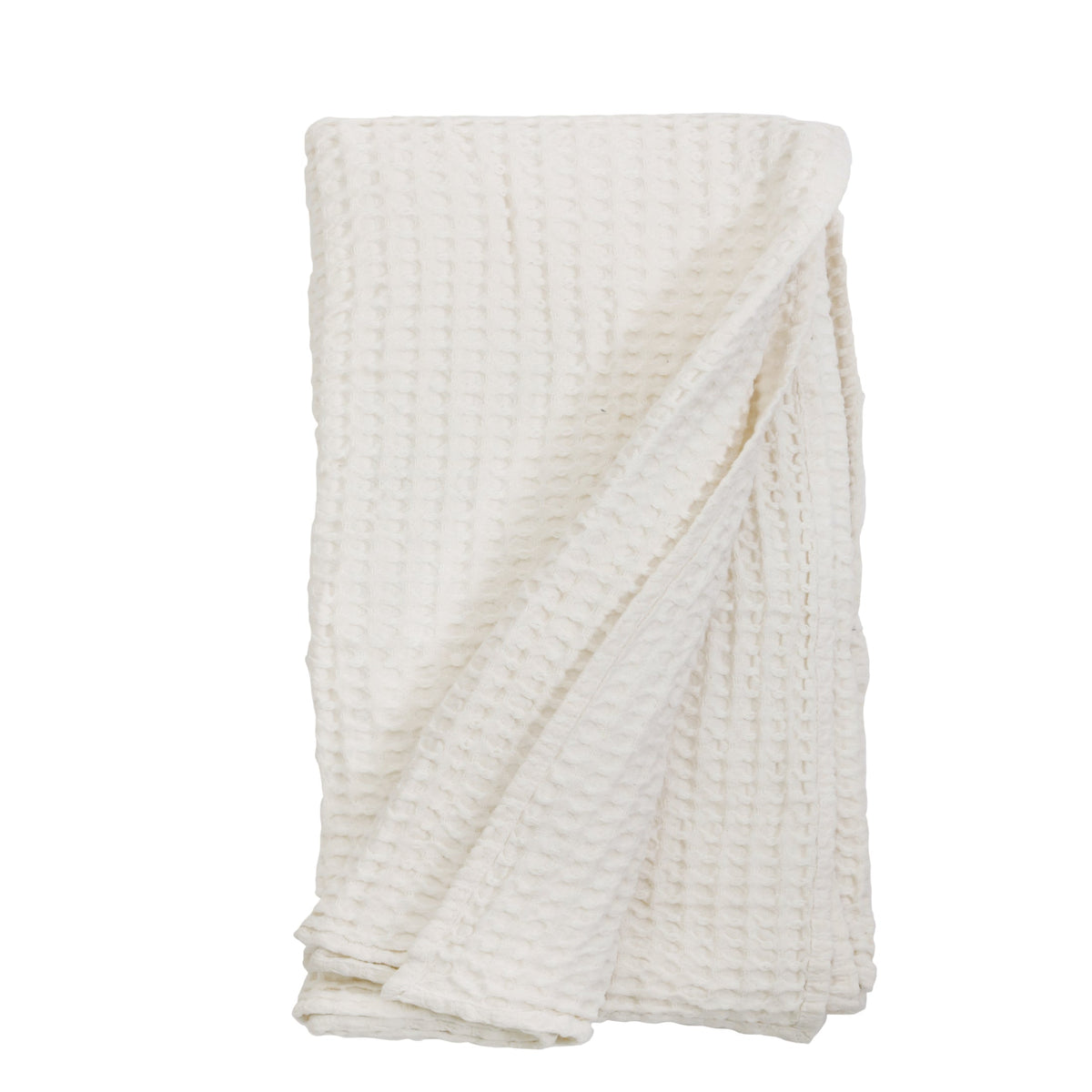 Cream waffle-knit throw blanket with folded diagonal overlay